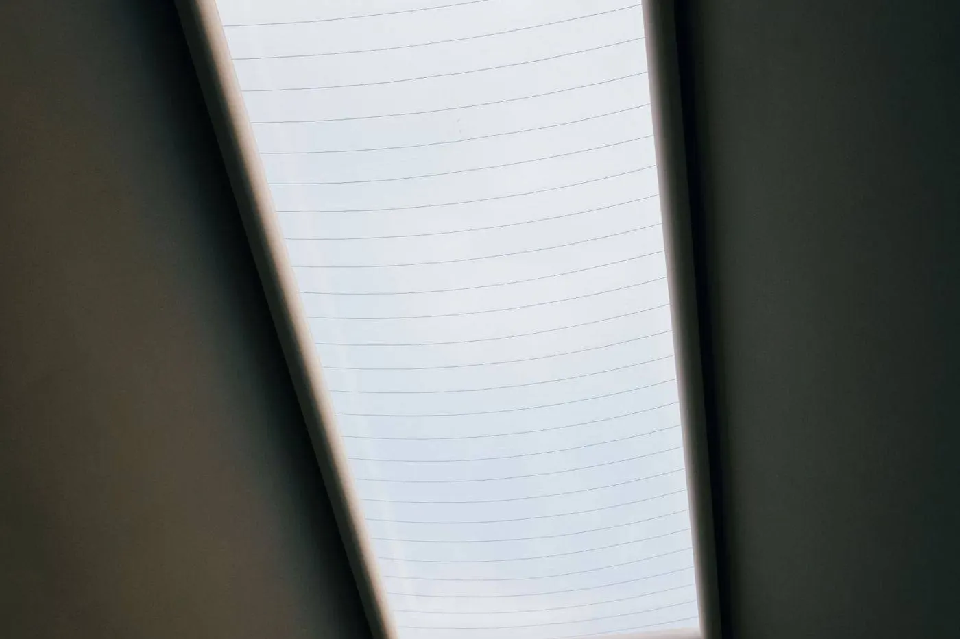 Water dripping from a skylight frame with stained surrounding drywall