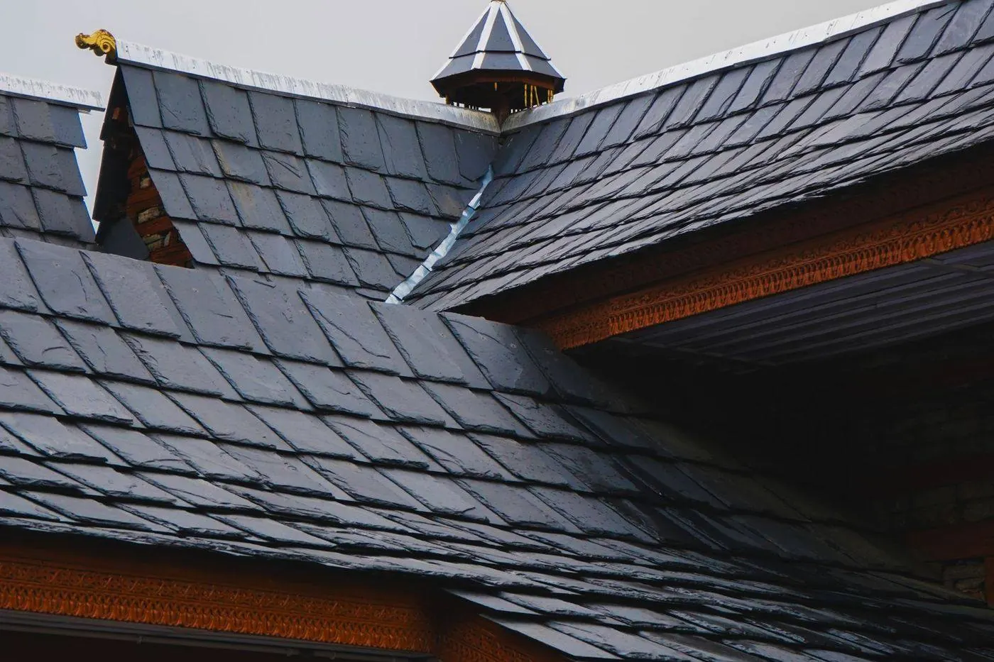 Metal valley flashing channel where two shingle roof slopes meet
